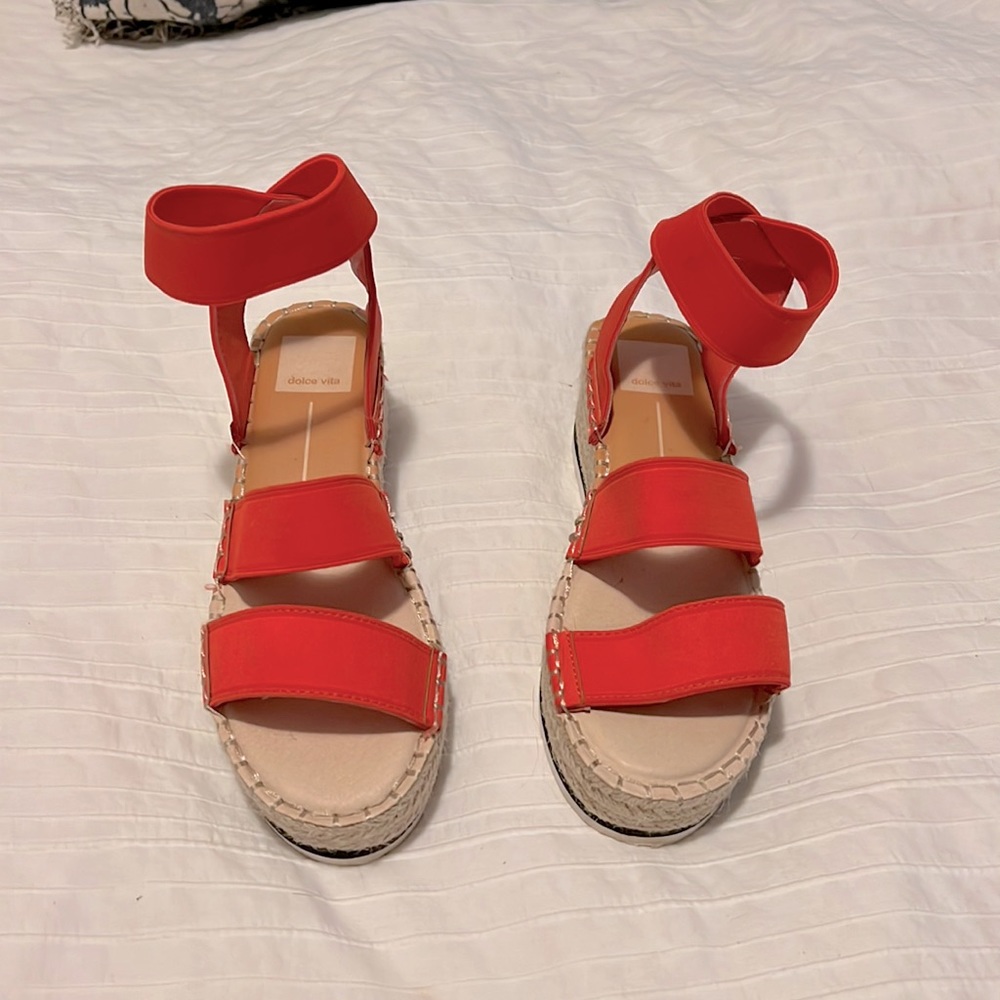 Dolce Vita orange platform sandals.